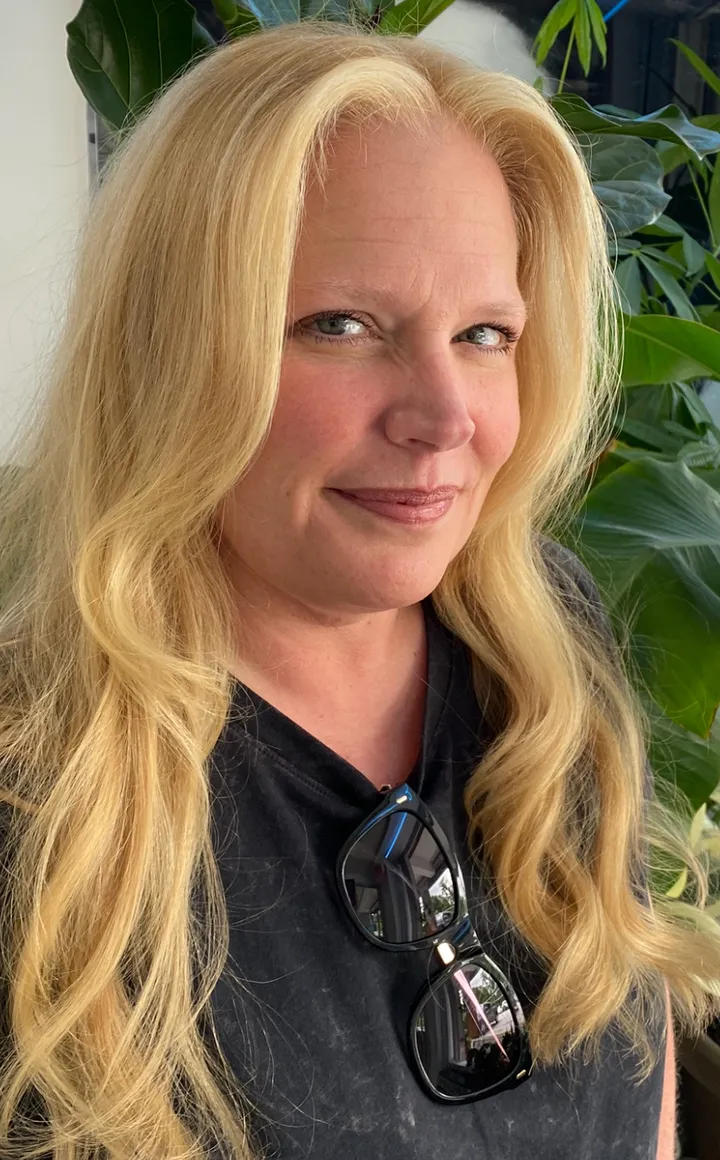 Light golden blonde hair with very soft waves and a natural finish